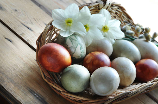 istock basket with organic painted easter eggs and flowers 1227230915