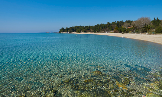 Agua clara en el mar cerca de Neas marmaras, Grecia photo