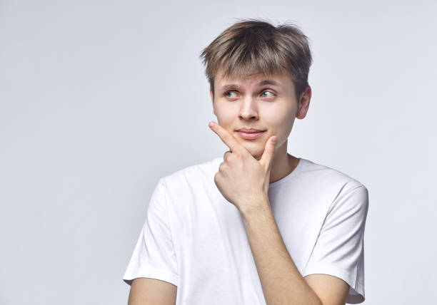 istock The young guy shows various emotions. Talented portrays the inner state and mood. Advertisement concept 1227233621