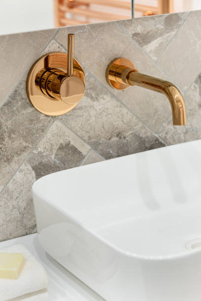 istock Golden tap in bathroom washbasin 1227235032