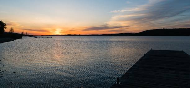 istock Sunset at Lake with Boardwalk 1227235185
