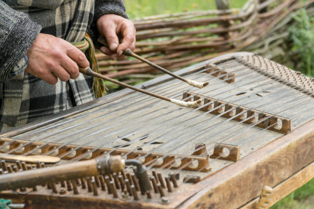 musician playing traditional hammered dulcimer (cymbalo) with mallets. - dulcimer imagens e fotografias de stock
