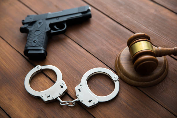 istock Handcuffs and a judge with gun 1227237767