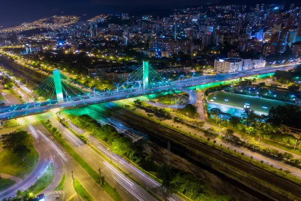 An aerial night view of the emblematic bridge on Medellin City called 4 Sur or (4th South) that connect Western and Eastern sides of the city over the Medellin River.