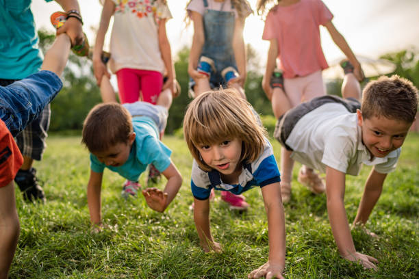 istock Wheelbarrow race in park 1227244606