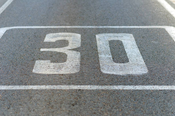 istock Speed limit signal painted on asphalt 1227245701