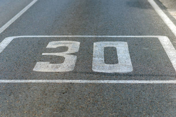 istock Speed limit signal painted on asphalt 1227245711