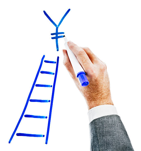 istock Man's hand draws Yen sign above ladder on white. 122725099