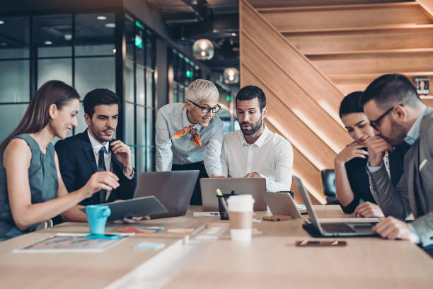 istock Mixed group of business persons working together 1227251182