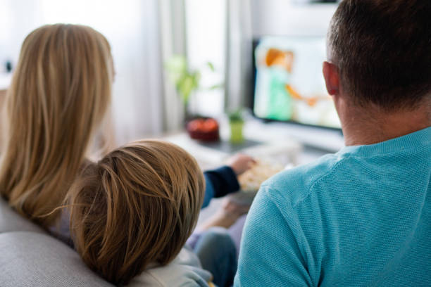 istock Close-up family watching TV in home quarantine 1227251983