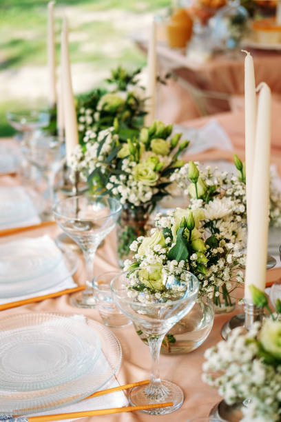 istock Festive table setting for the wedding venue. Peach summer decoration. 1227253433
