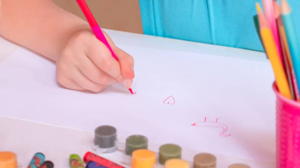 istock Little girl drawing 1227255898