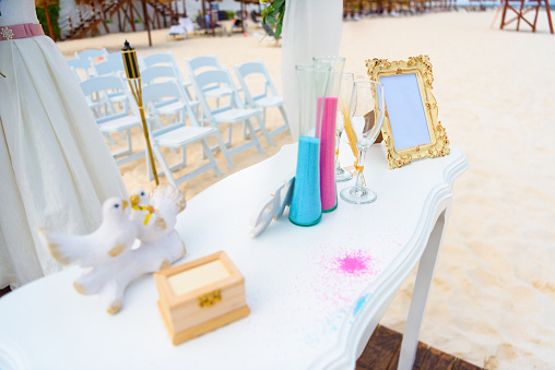White table for a wedding ceremony on the seashore.