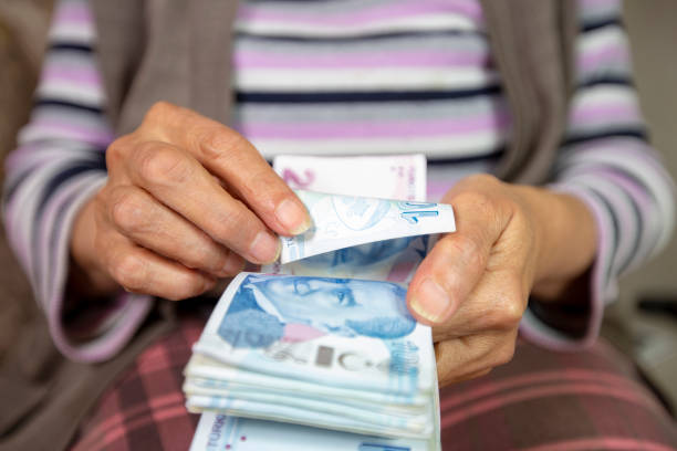 old hand with turkish lira. counting Turkish lira stock photo