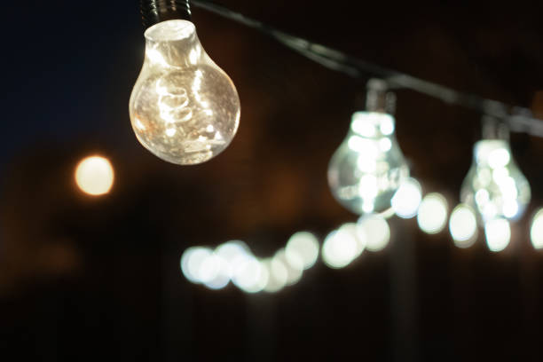 istock A bunch of bulbs on a dark background with bokeh. 1227258761