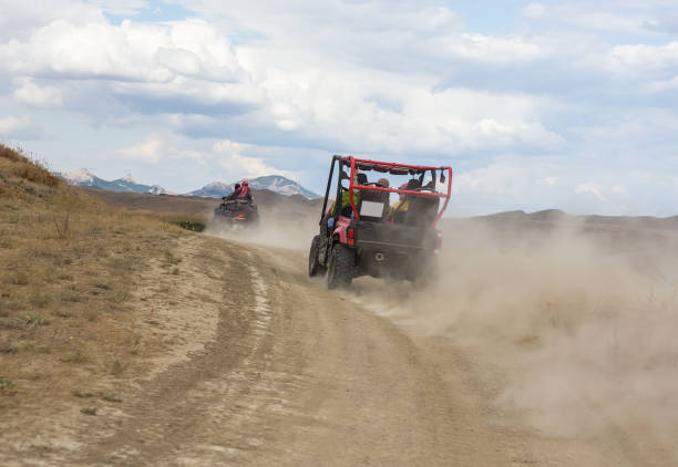istock Buggy moves on a dirt dusty road 1227258764