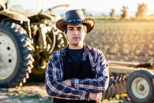 istock Young farmer worker posing looking at the camera with his arms crossed 1227259505