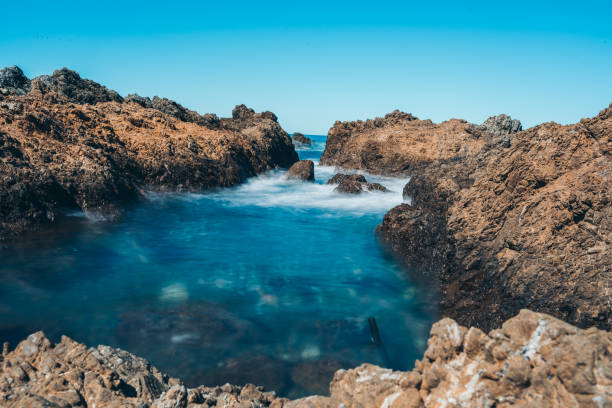 istock Long Exposure Of Sea Wave with rock 1227261110