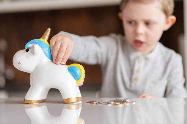 istock A young boy saves money 1227261133