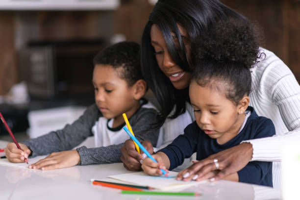 istock A mother teaches her children how to draw 1227261179