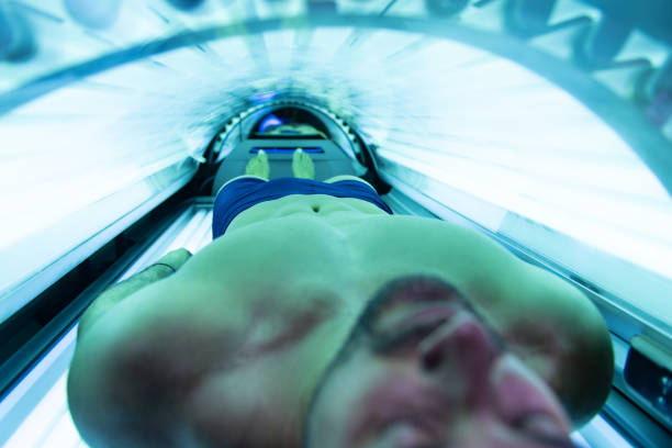 istock Young Man At Solarium In Beauty Salon 1227261484