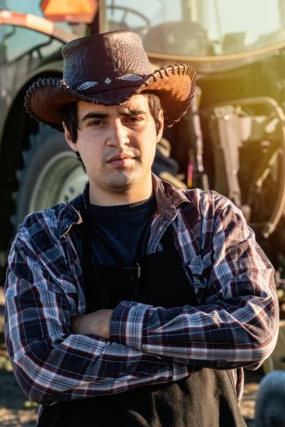 istock Young farmer worker posing looking at the camera with his arms crossed 1227263210