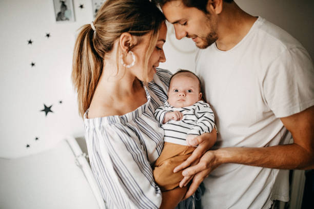 istock Parents holding their baby 1227264449