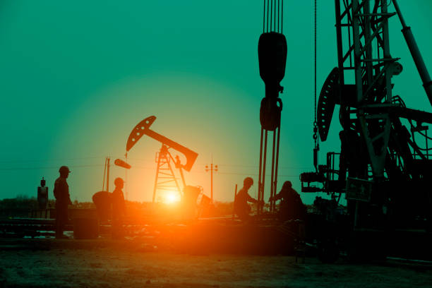 istock Oil drilling exploration, the oil workers are working 1227264476