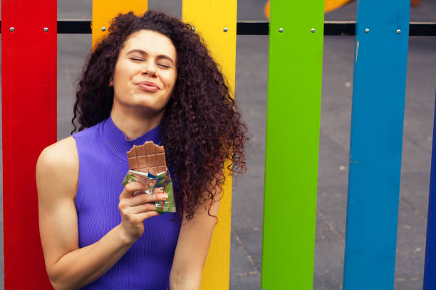 istock Young woman eating chocolate 1227266721