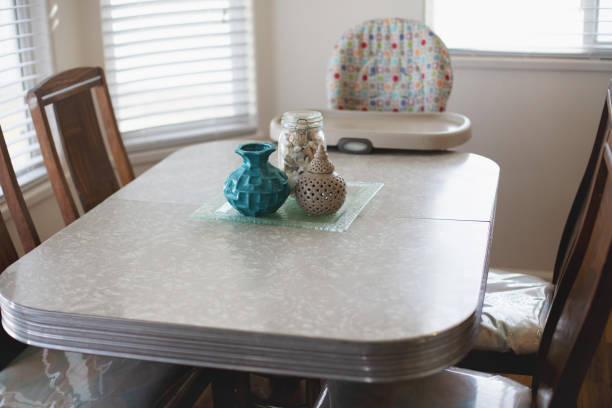 Retro Dine in Kitchen Area of Home Interior with baby high chair In Western Colorado Retro Dine in Kitchen Area of Home Interior with baby high chair with No People (Shot with Canon 5DS 50.6mp photos professionally retouched - Lightroom / Photoshop - original size 5792 x 8688 downsampled as needed for clarity and select focus used for dramatic effect) retro 1950s kitchen stock pictures, royalty-free photos & images