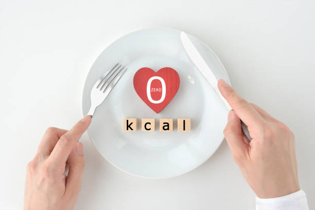 Diet images, wooden blocks with kcal words on white plate Diet images, wooden blocks with kcal words on white plate cytoplasm photos stock pictures, royalty-free photos & images