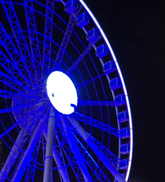 istock Blue neon light ferris wheel with black background 1227280026