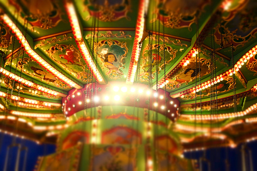 Vienna, Austria - October 23, 2019:\nDetailed view of an old carousel decorated with historical illustrations in the Vienna Prater. Selective Focus