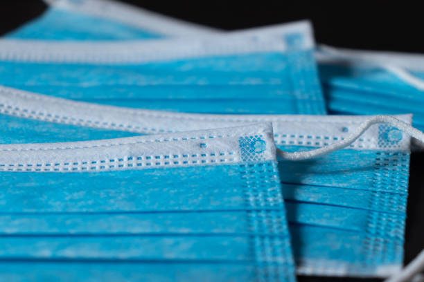 istock Surgical masks close up dark background 1227282880