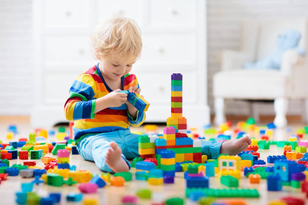 istock Child playing with toy blocks. Toys for kids. 1227282936