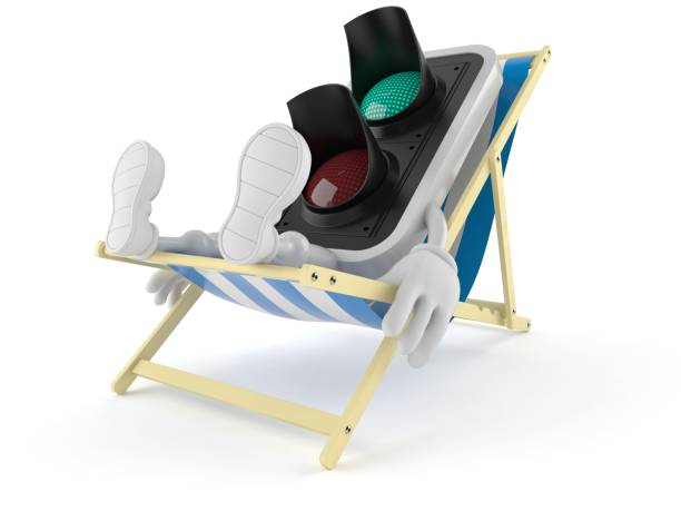 istock Green traffic light character lying on deck chair 1227283041
