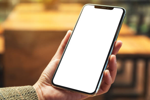 istock a woman holding mobile phone with blank white desktop screen 1227284192