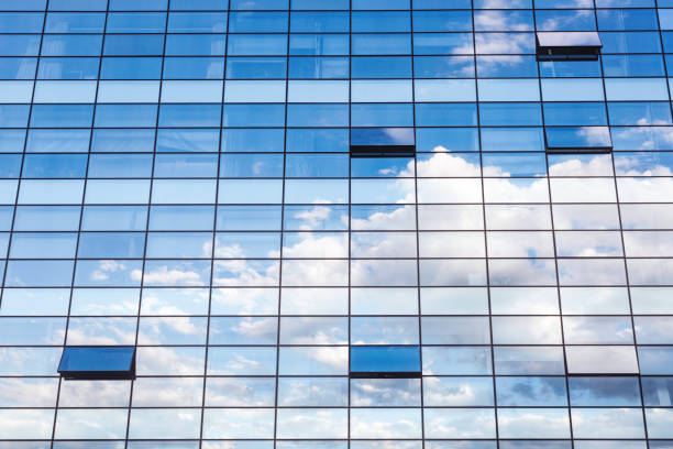istock City building glass reflecting sky clouds 1227286003
