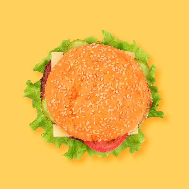 istock Classic cheeseburger isolated on yellow background. 1227286920