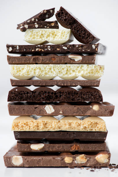 istock Different kinds of chocolates with nuts cocoa powder and mint - selective focus, white background 1227289237