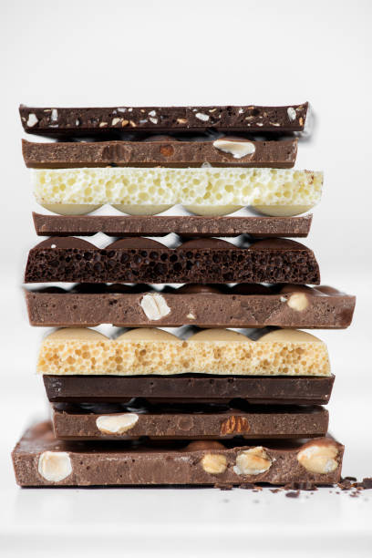 istock Different kinds of chocolates with nuts cocoa powder and mint - selective focus, white background 1227289238