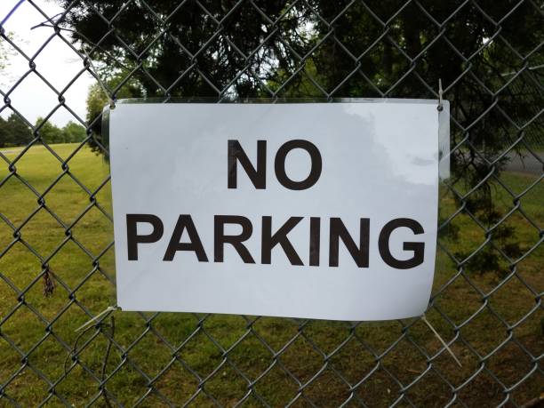 istock no parking sign on metal chain link fence 1227289364
