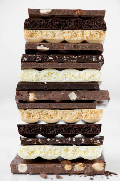 istock Different kinds of chocolates with nuts cocoa powder and mint - selective focus, white background 1227289618
