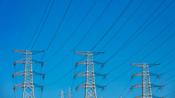 istock High power electricity poles connected to smart grid at clear sky 1227289744