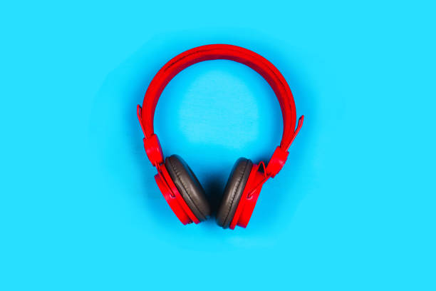 istock Red headphones on blue background. Music concept 1227291075