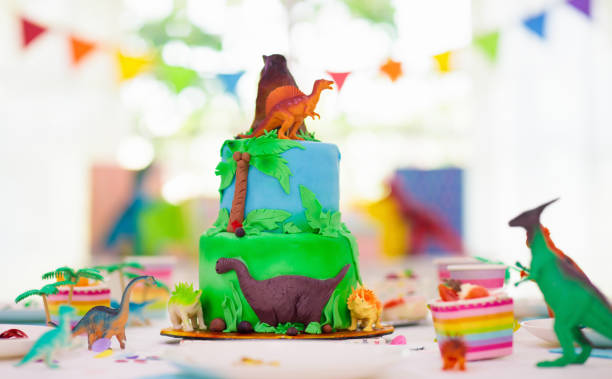 istock Kids birthday party. Dinosaur theme cake. 1227291894