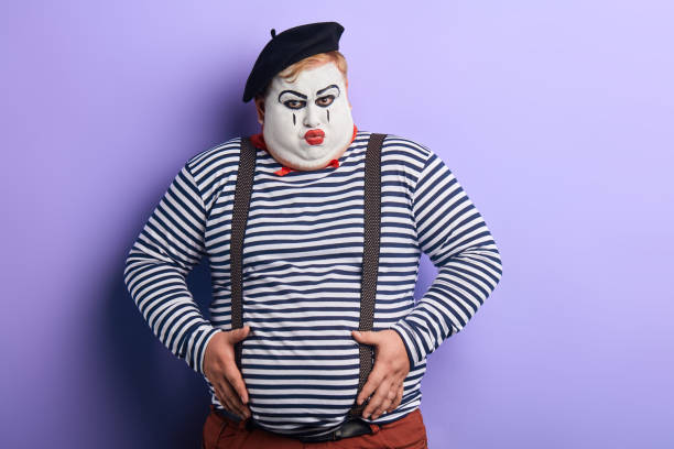 istock funny clown pretending air balloon 1227292040