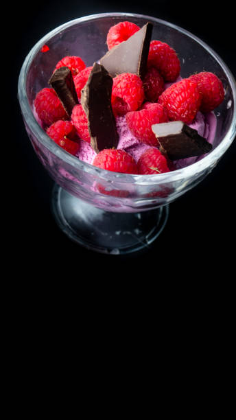 Cup with raspberry ice cream and chocolate.