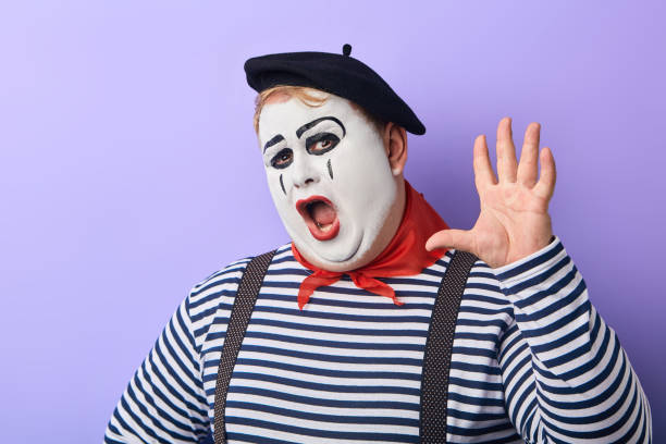 istock funny plump clown with raised arm shoiting at the camera 1227292189