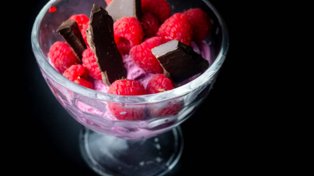 Cup with raspberry ice cream and chocolate.